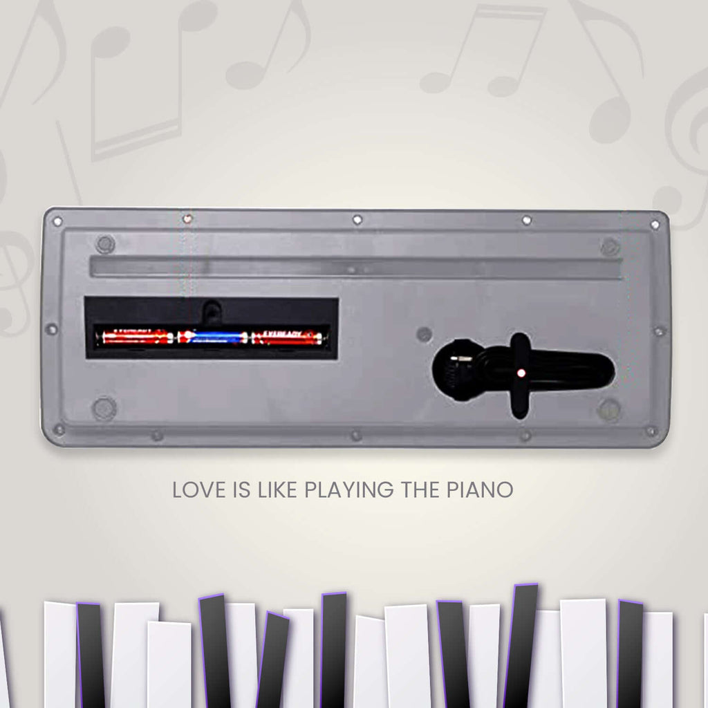 Kids piano keyboard microphone with attached microphone for music and singing fun.