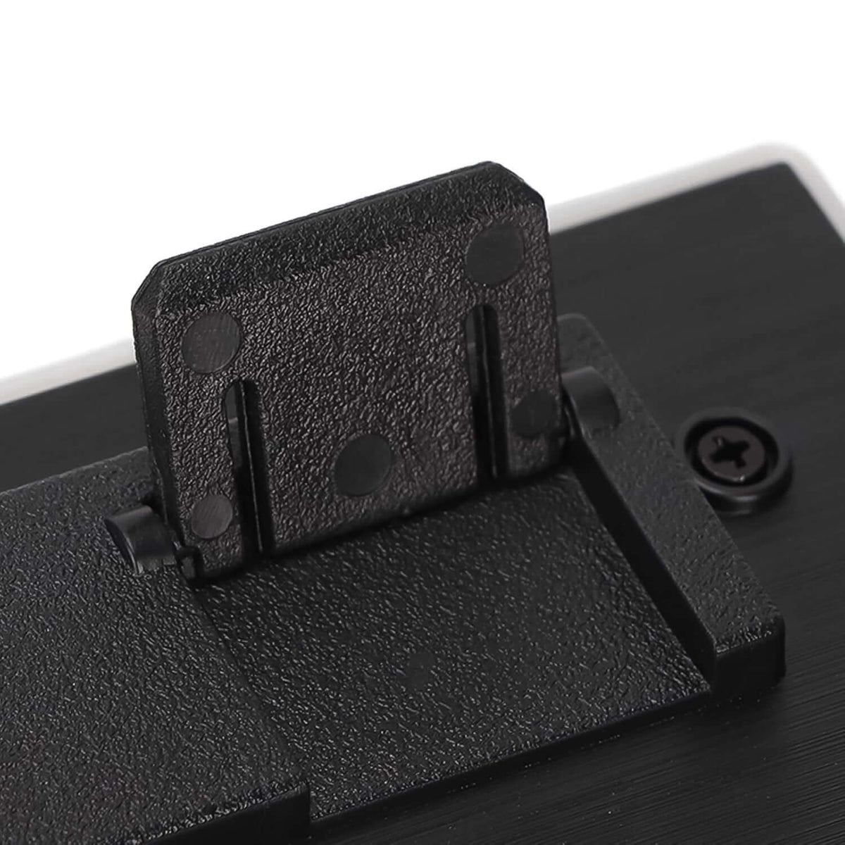 Close-up of the adjustable stand mechanism on a backlit gaming keyboard and mouse set.
