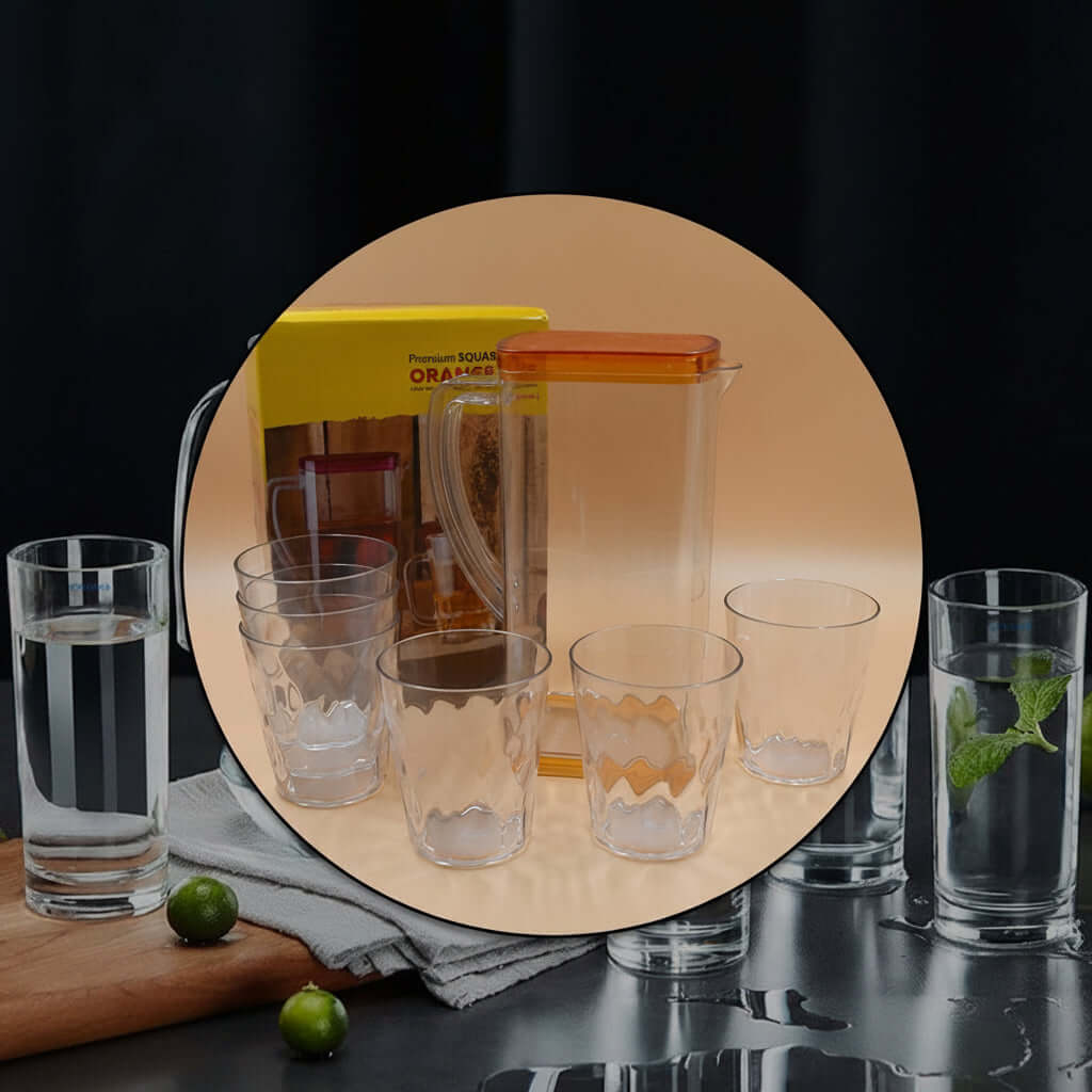Heat-resistant glass jug set featuring a 2000 ml jug with lid and six matching 300 ml glasses on a modern table.