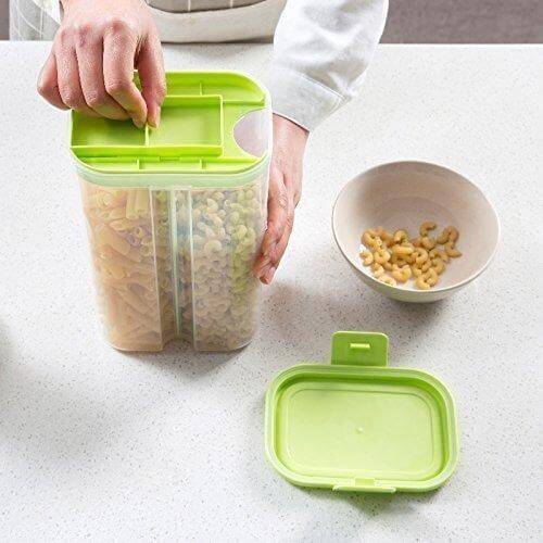 A person using a 2-section airtight cereal storage container 2L to store pasta on a kitchen counter.