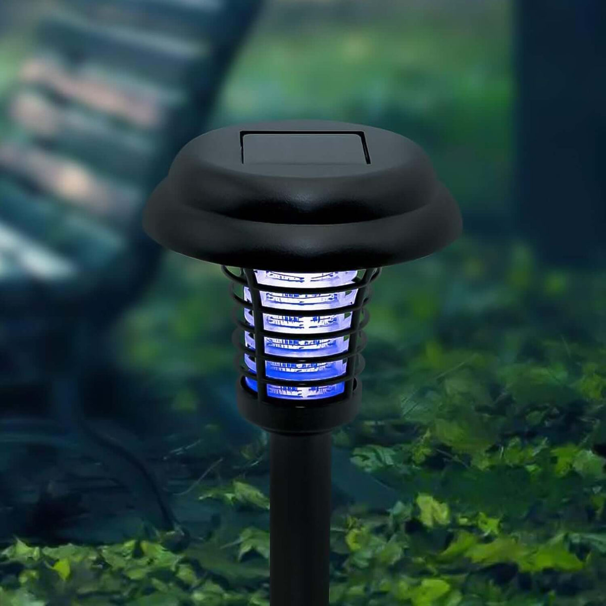 Solar UV mosquito trap garden lights in a green garden, designed to attract and zap mosquitoes.