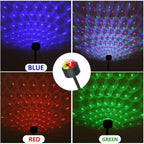 USB star night light projector showcasing vibrant colors in blue, red, and green patterns on the ceiling.