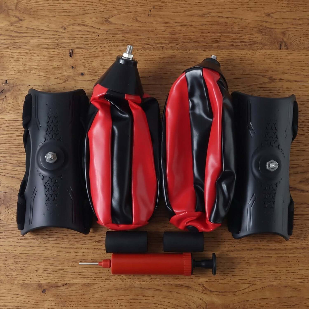 Inflatable punching bag with air pump parts including bag and pump on wooden surface.