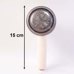 Rechargeable lint remover for clothes with a 15 cm cylindrical handle and stainless steel lint removal head.