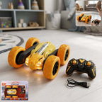 Remote control flip stunt car with LED lights and controller on a wooden floor.