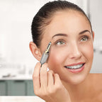 Woman using 2-in-1 eyebrow razor and painless hair shaver for precise eyebrow shaping.