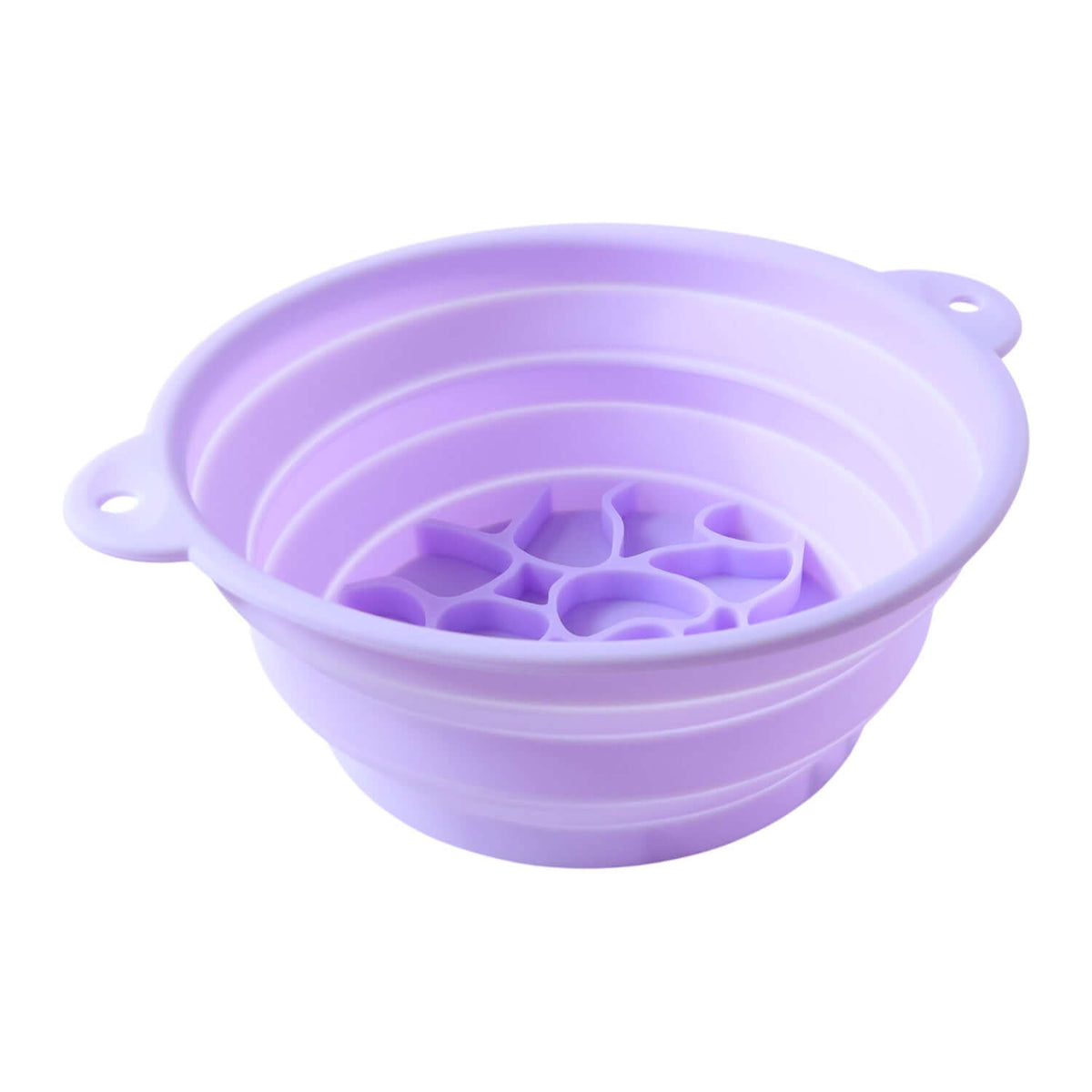 Collapsible silicone facial ice bath bowl in light purple color with tray base for utility and easy storage.