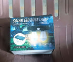 Solar Double LED Wall Lamp (2W) packaging displaying features and usage in outdoor settings.