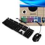 104-Key Backlit Gaming Keyboard & Mouse Set (2 Pc) displayed on a wooden desk with a coffee cup.