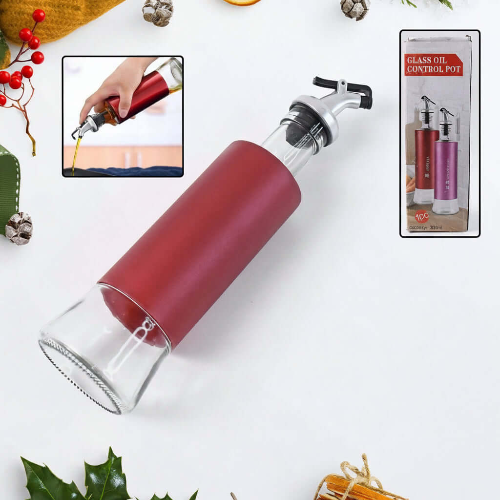 Glass oil vinegar dispenser bottle with a golden pour spout for precise pouring.
