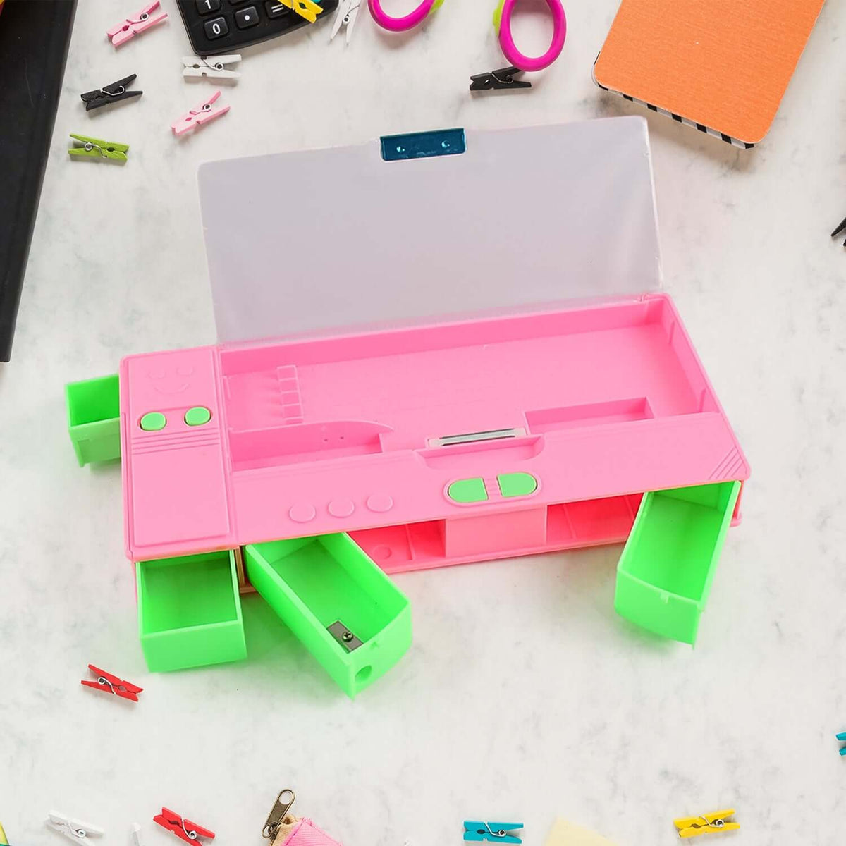 Jumbo Geometry Box with Calculator in bright pink color, showcasing open design with green compartments for school supplies.
