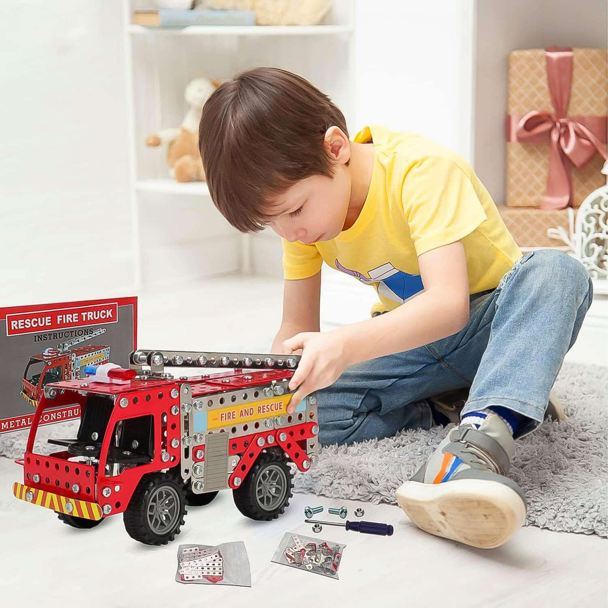 Child assembling 292-Piece Metal DIY Fire Truck Building Blocks with metal parts and tools.