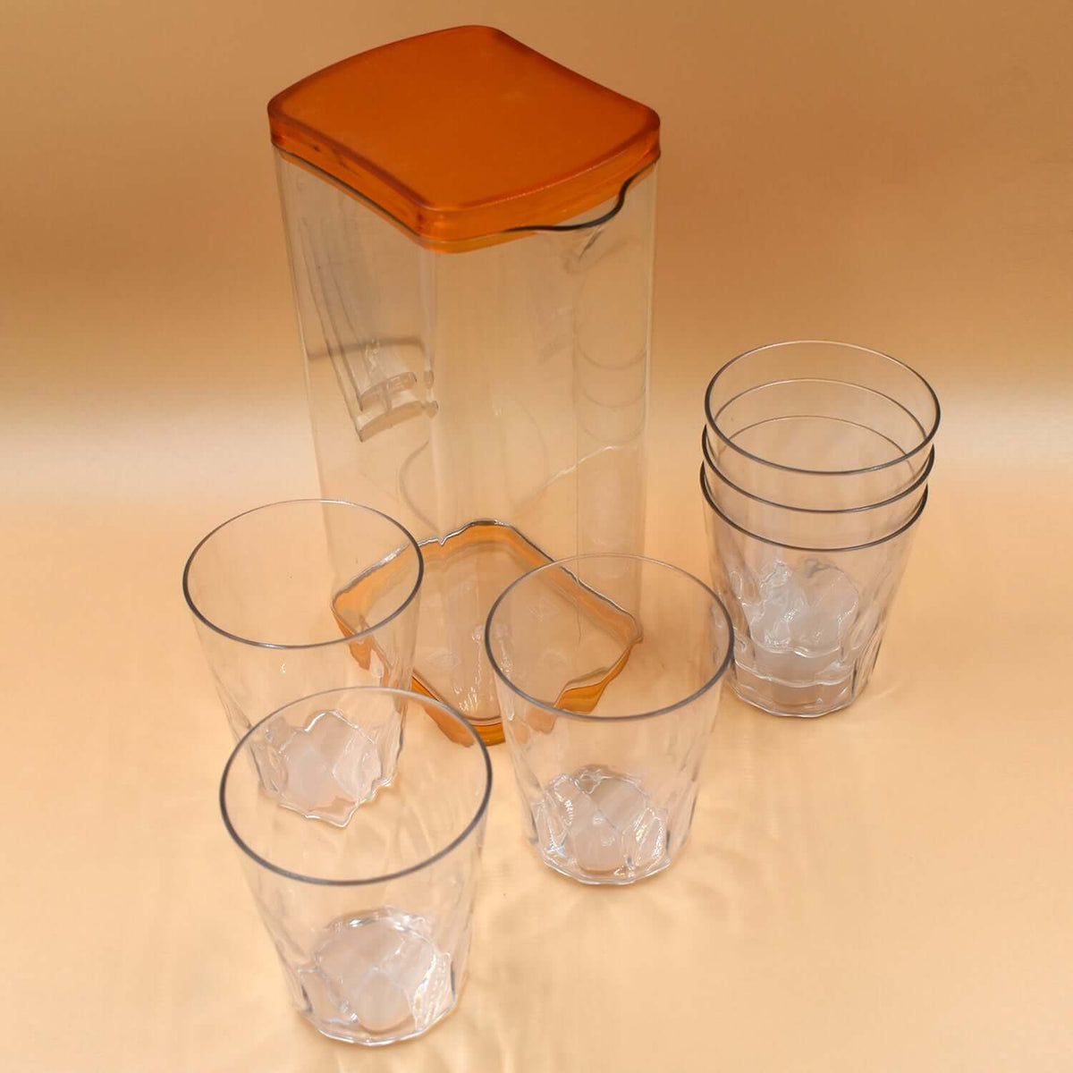 Heat-resistant glass jug set with one jug and four matching glasses, designed for hot and cold beverages.