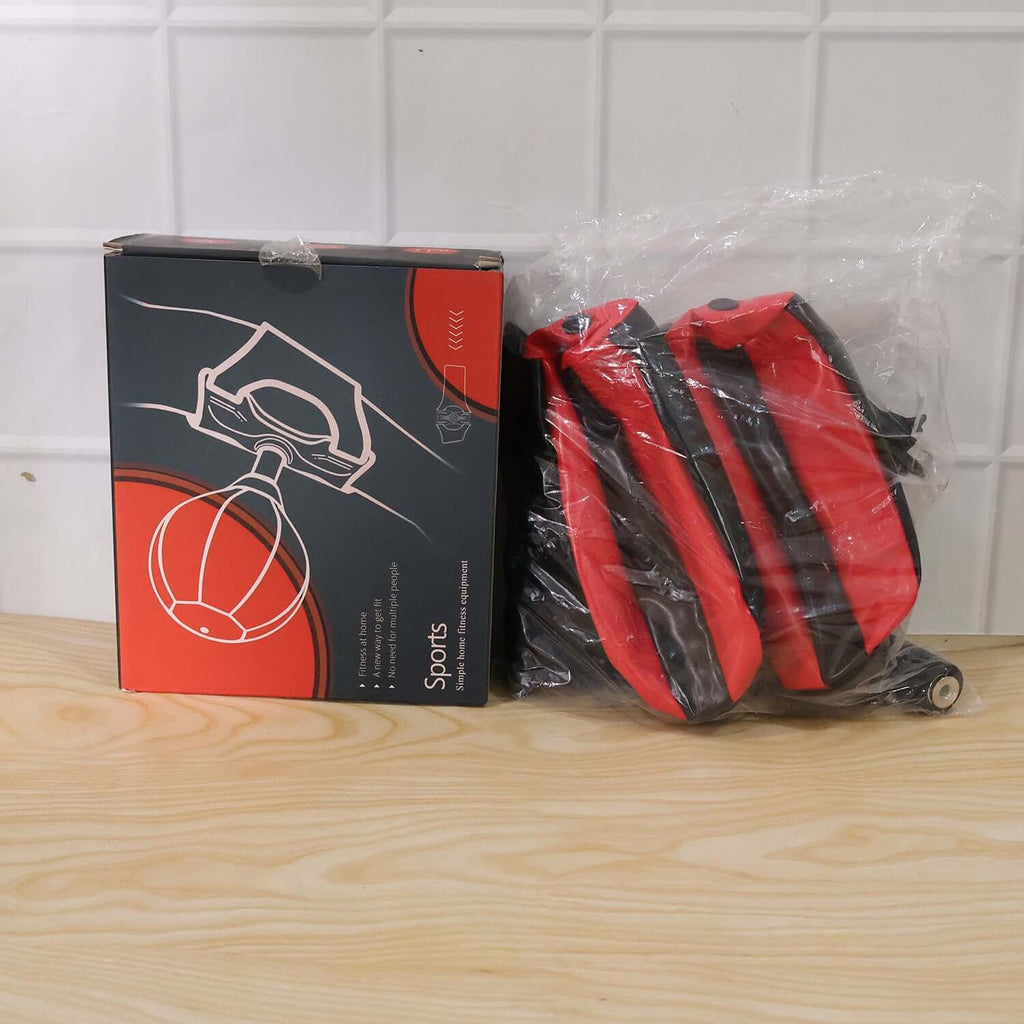 Inflatable Punching Bag with Air Pump (B-Grade, 1 Pc) alongside packaging on wooden table surface.