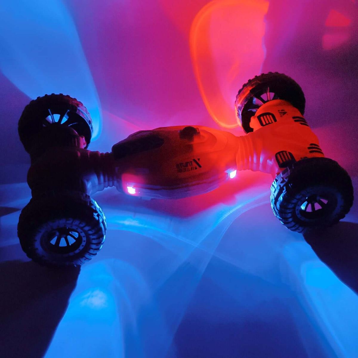 Remote control deformation stunt car with lights spinning on a colorful background, showcasing its one-key transformation.